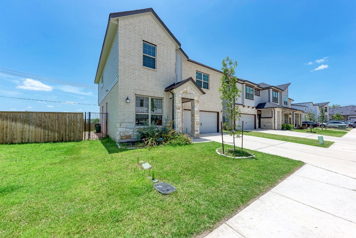 a front view of a house with a yard