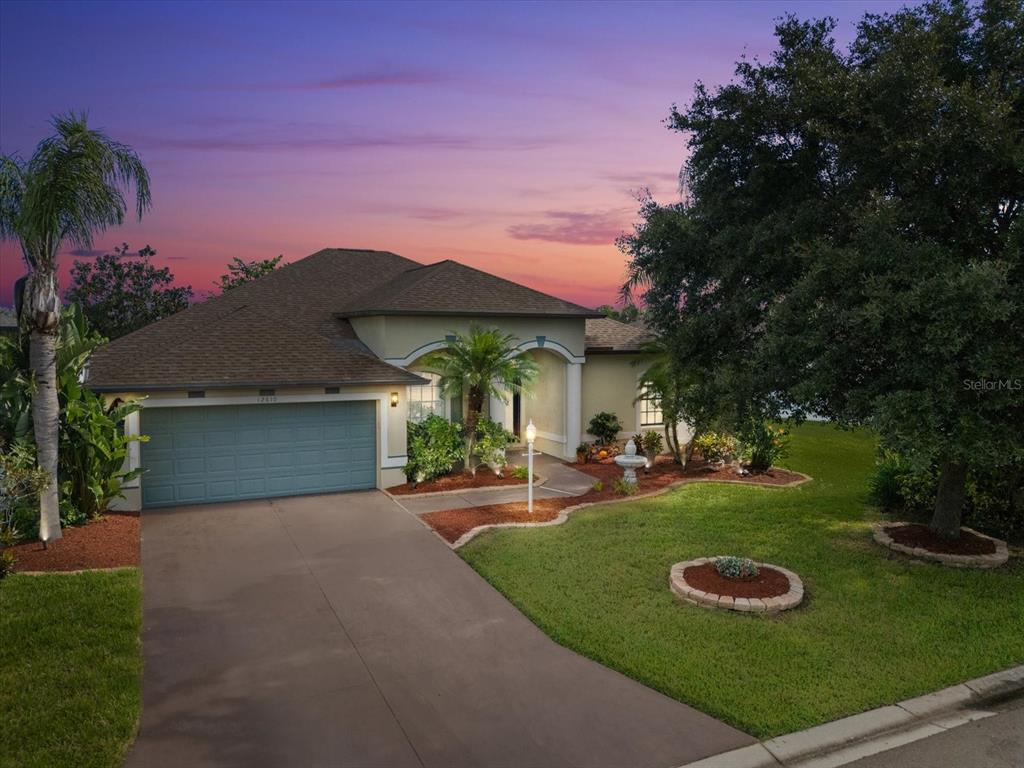 a view of a house with backyard and porch