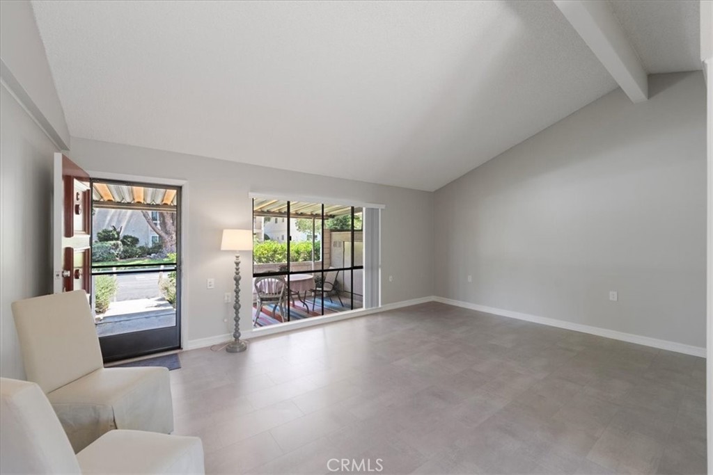 a view of livingroom with furniture and floor to ceiling window