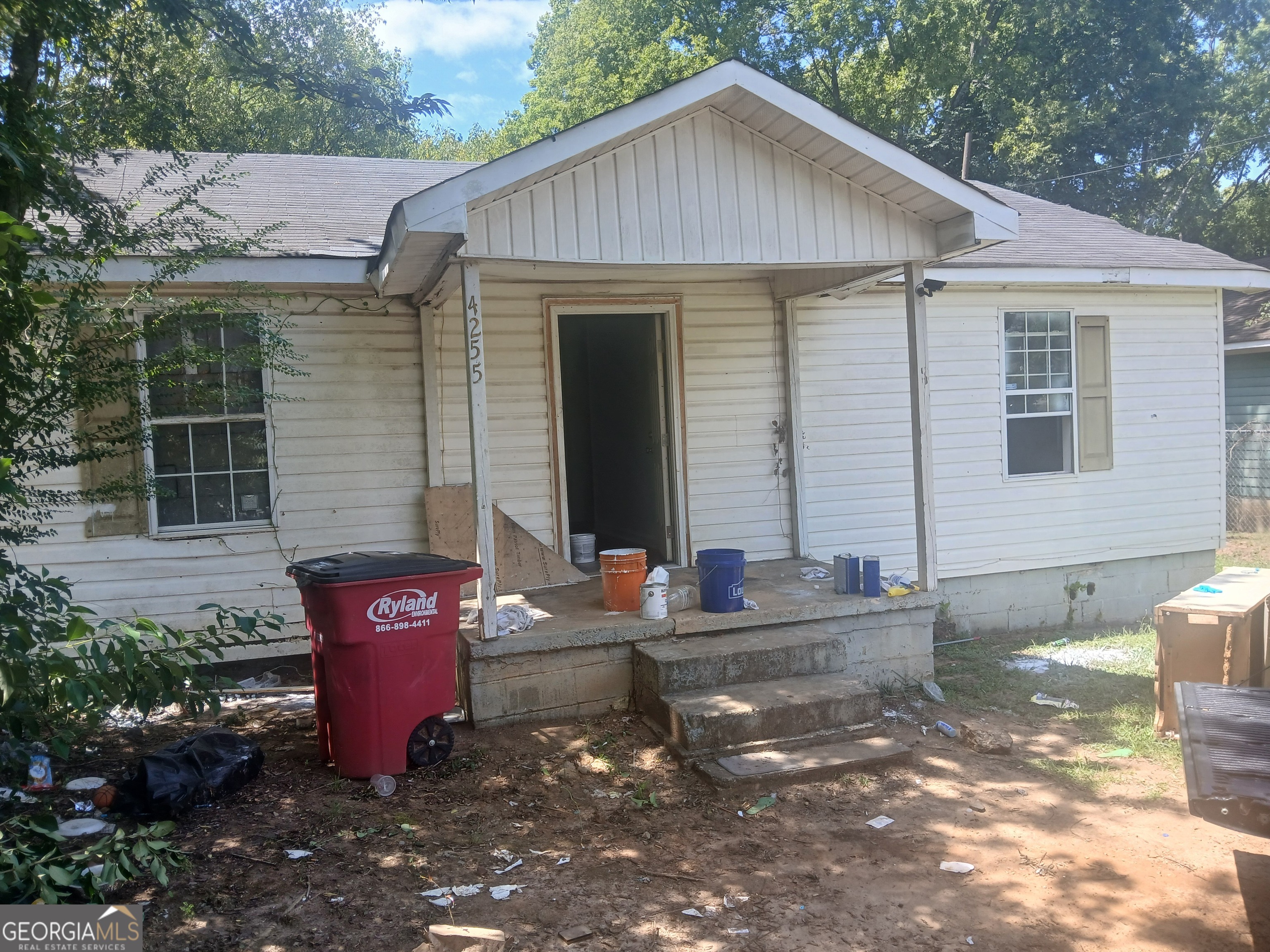 a front view of a house with table and chairs