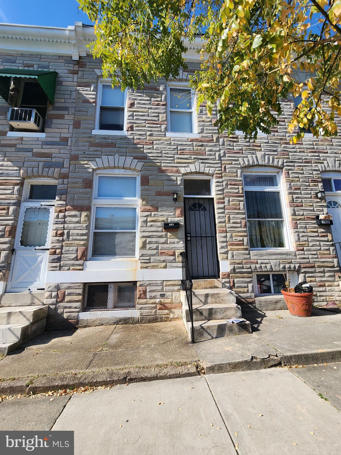 a front view of a house with parking area