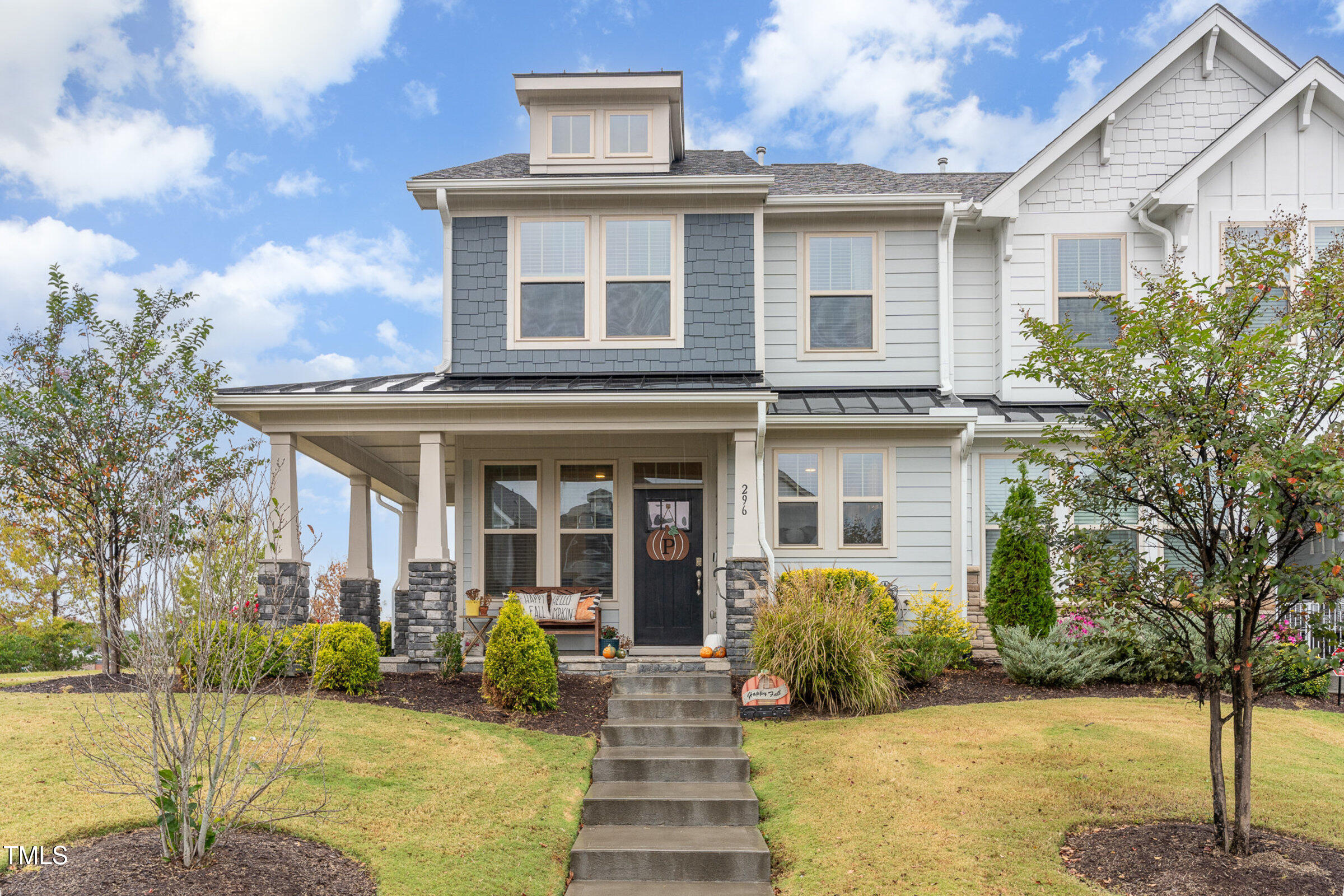 a front view of a house with garden