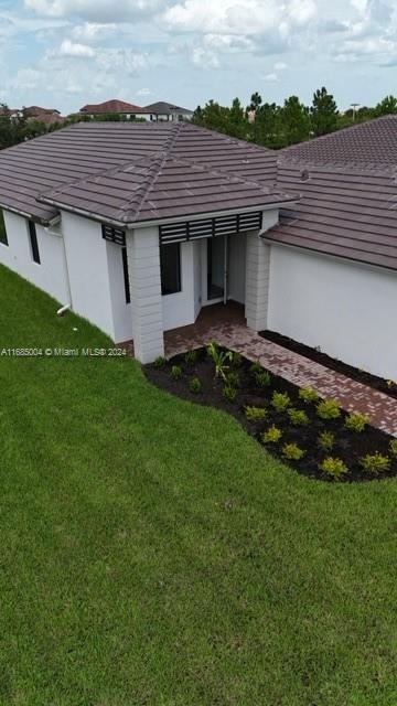 a aerial view of a house with a garden and plants