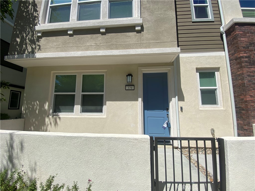 a front view of a house with a large windows