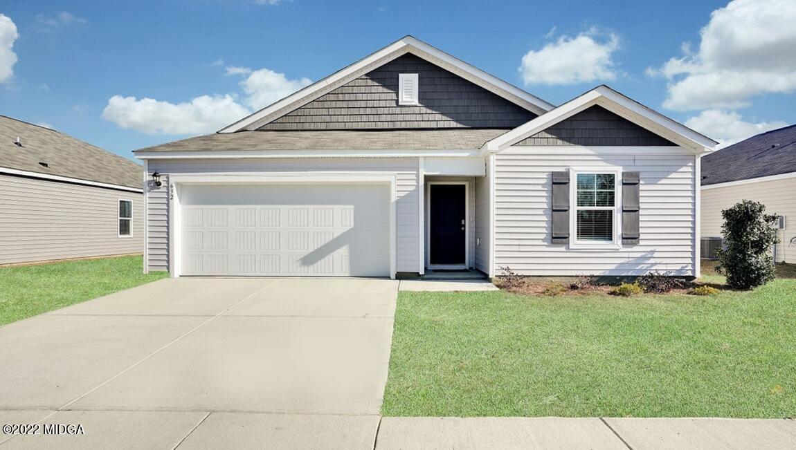 a front view of a house with a yard