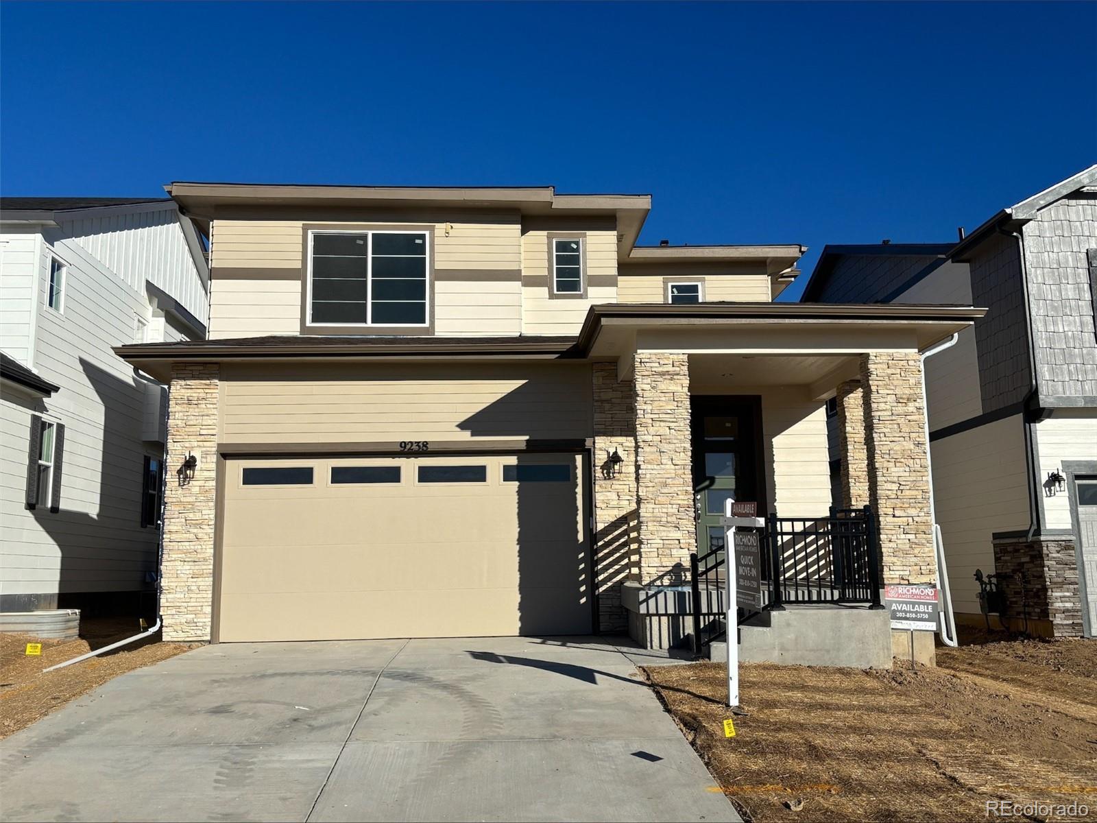 a front view of a house with a garage