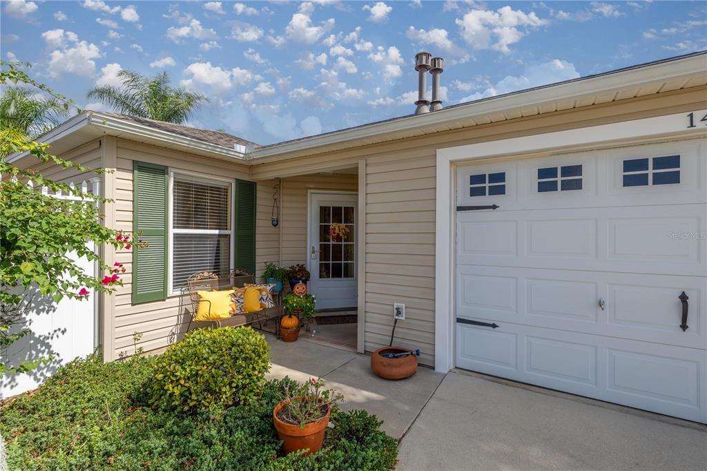 a front view of a house with patio