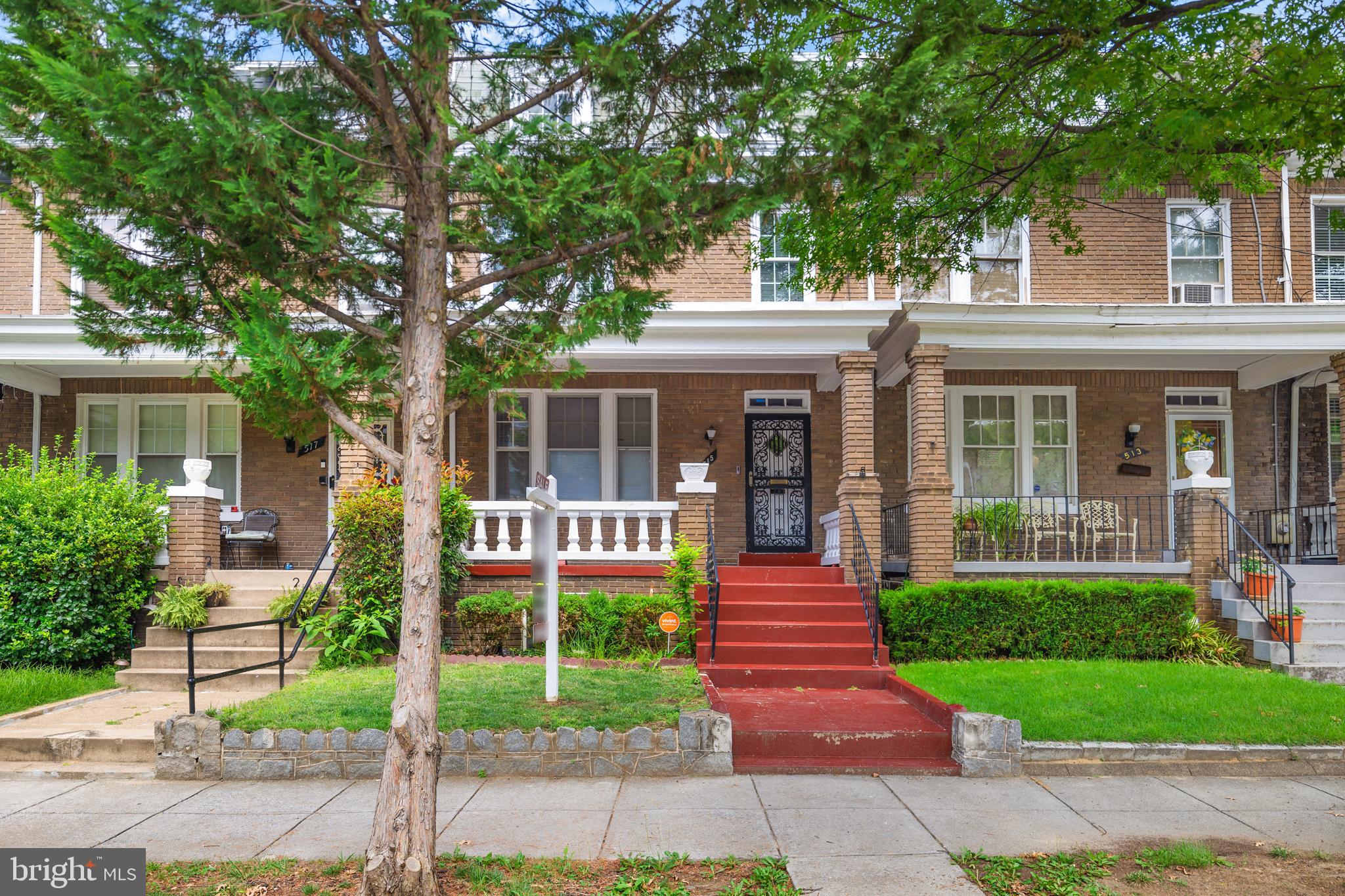 front view of a house with a yard