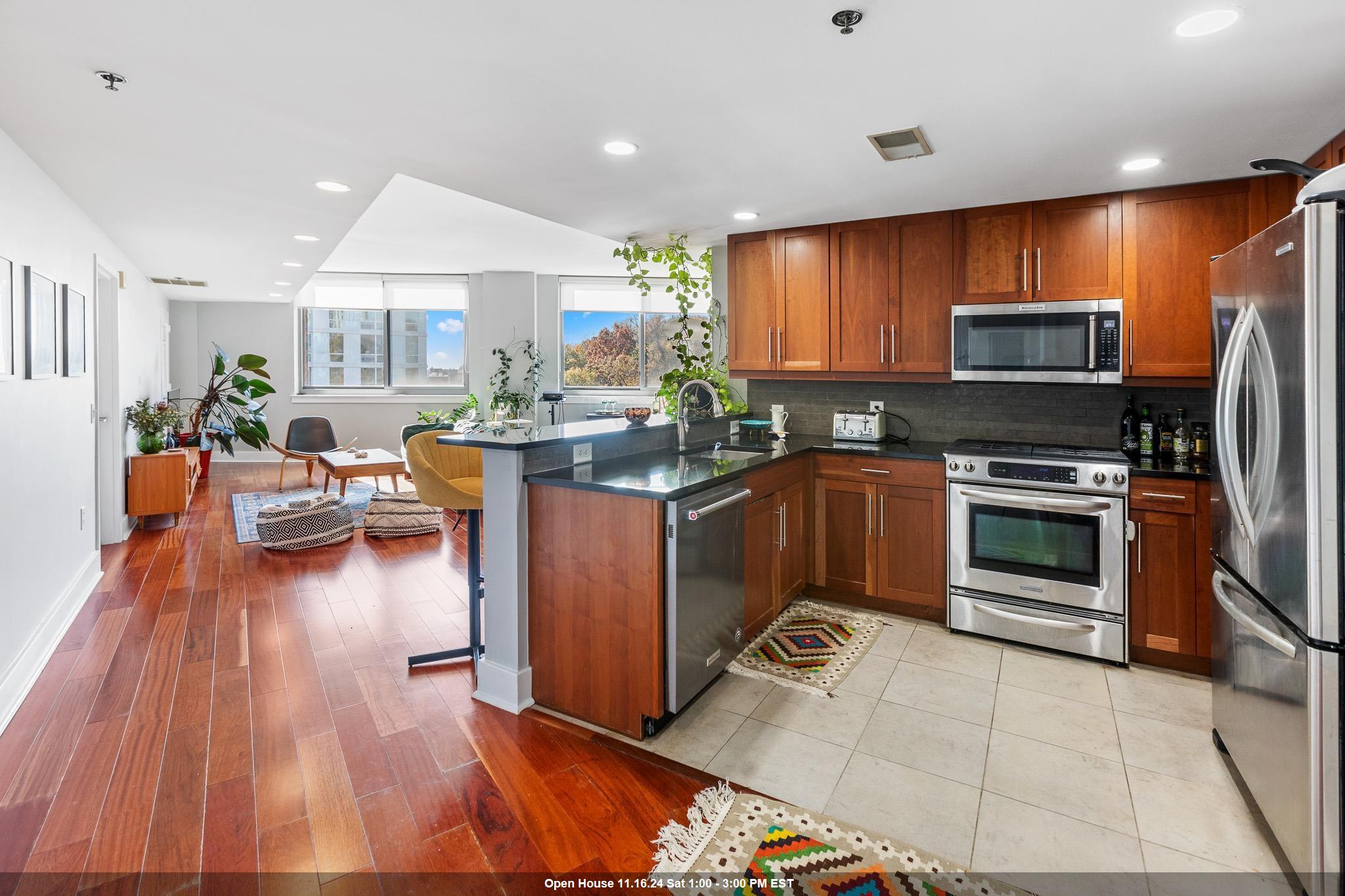 a kitchen with a sink appliances and cabinets