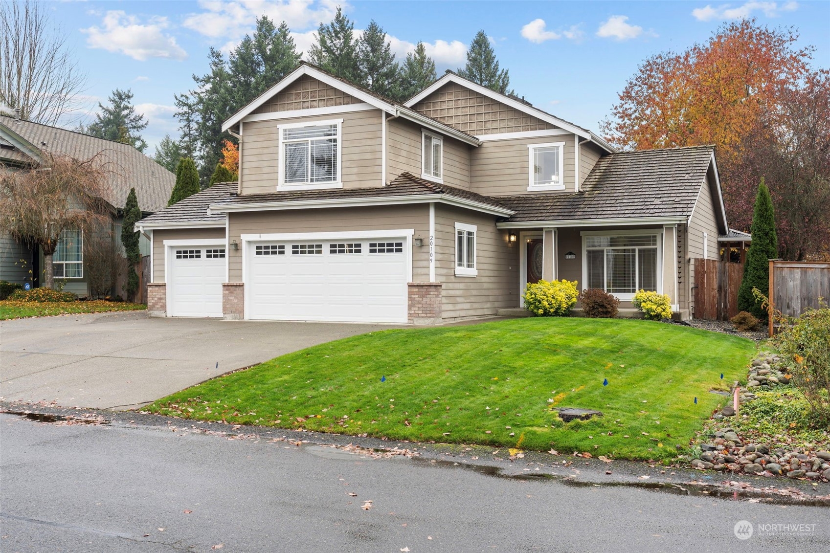 a view of a yard in front view of a house