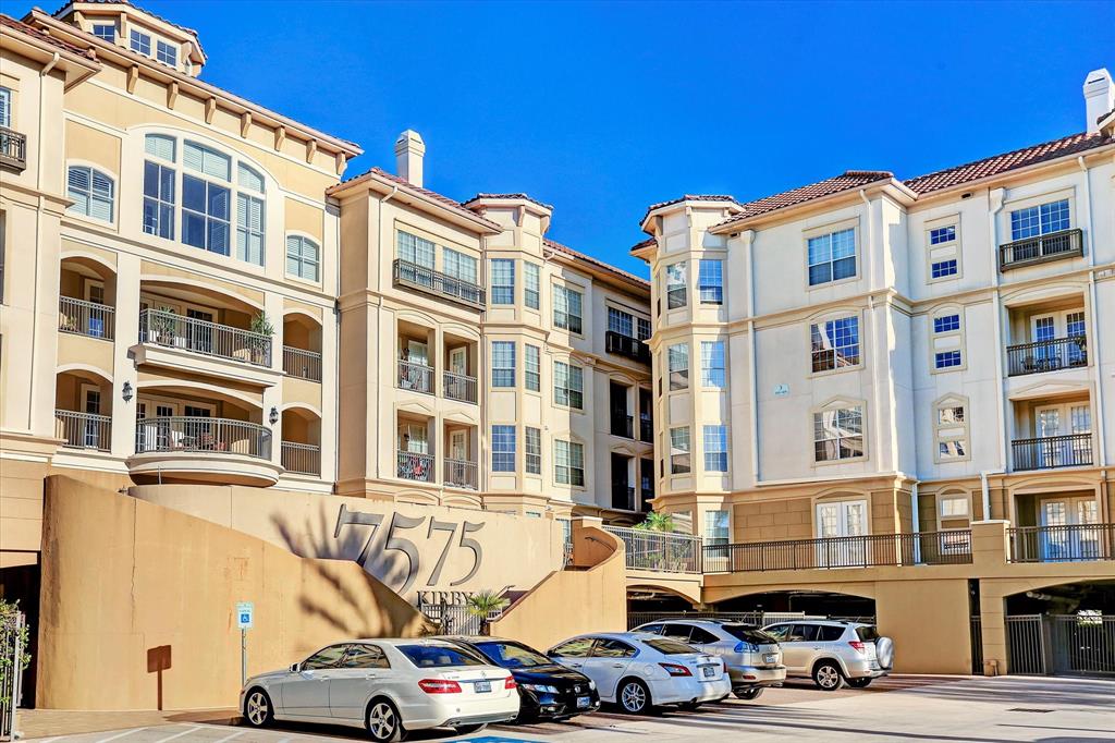 a front view of a building with parking space