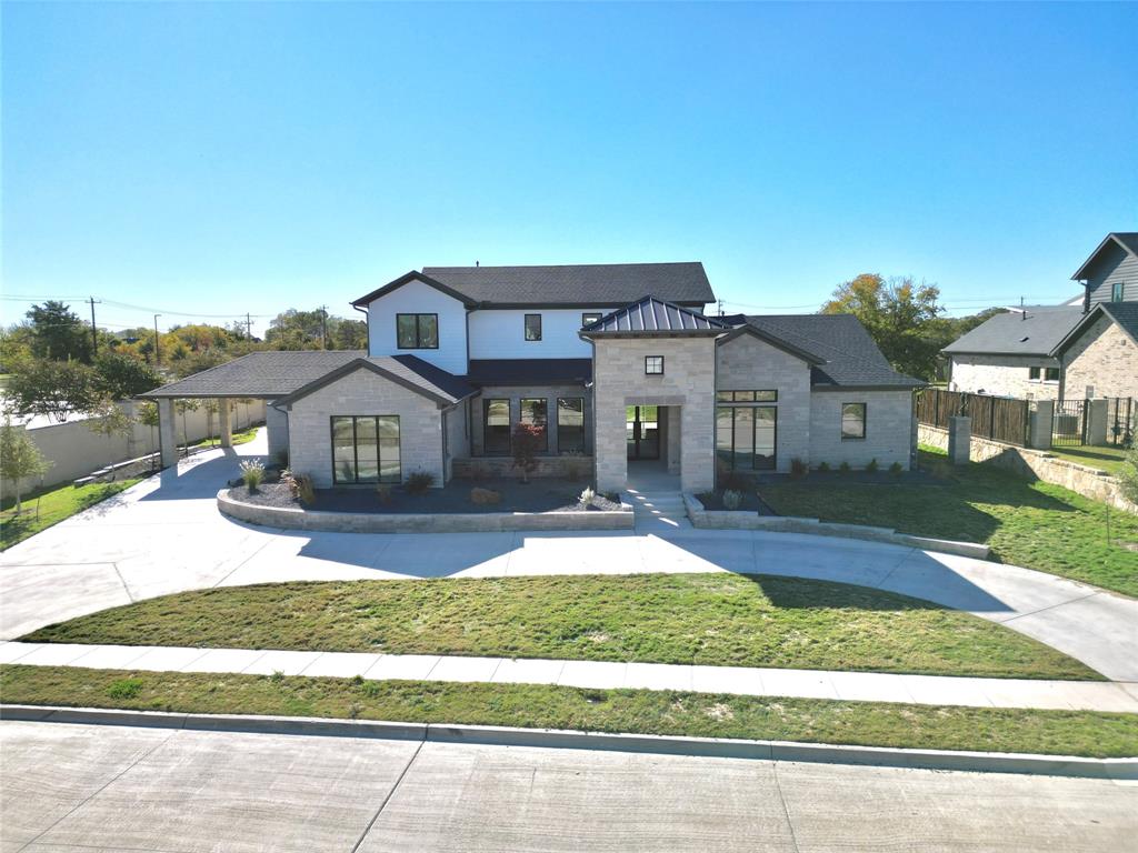 front view of a house with a yard