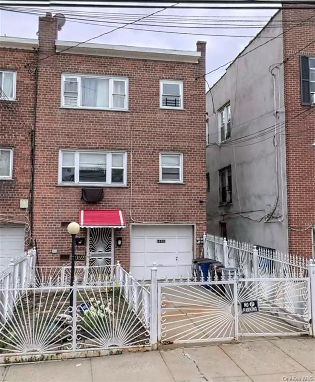 View of property featuring a garage