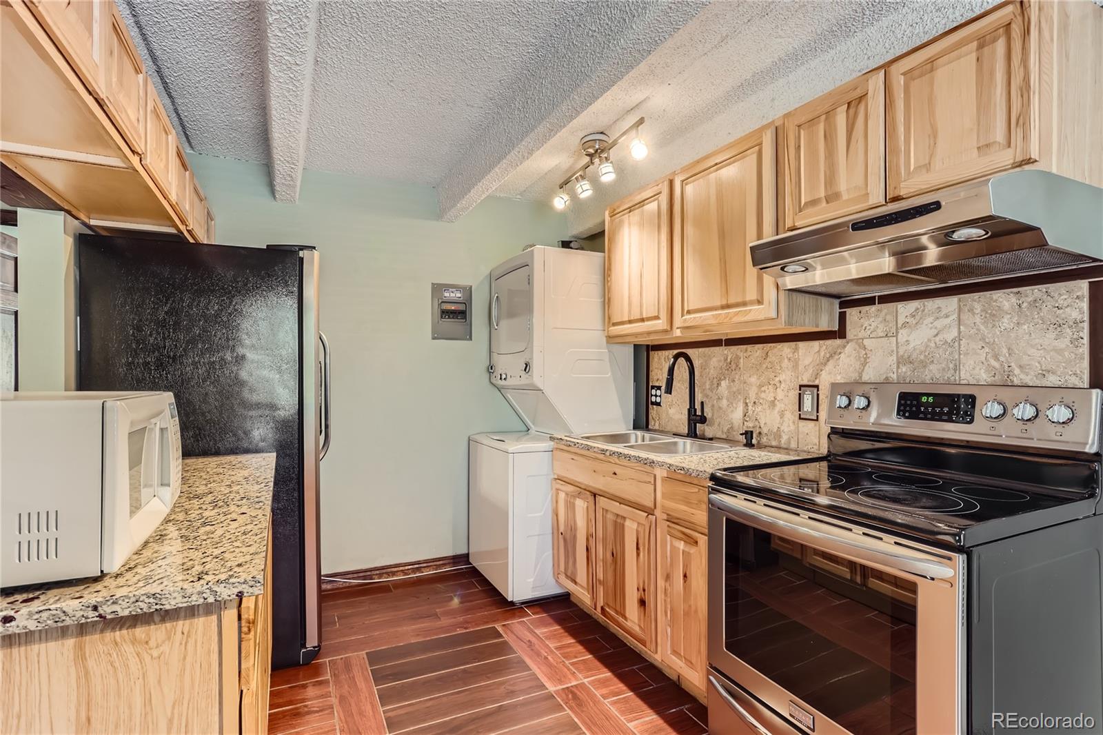 a kitchen with a stove and a sink