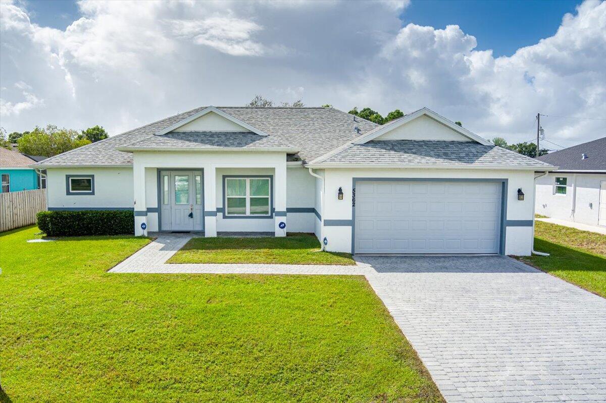 a front view of a house with a yard