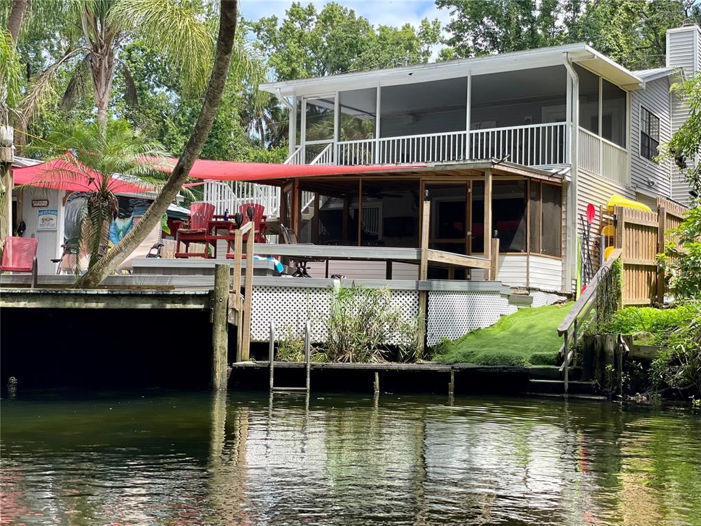 a house with river in front of it