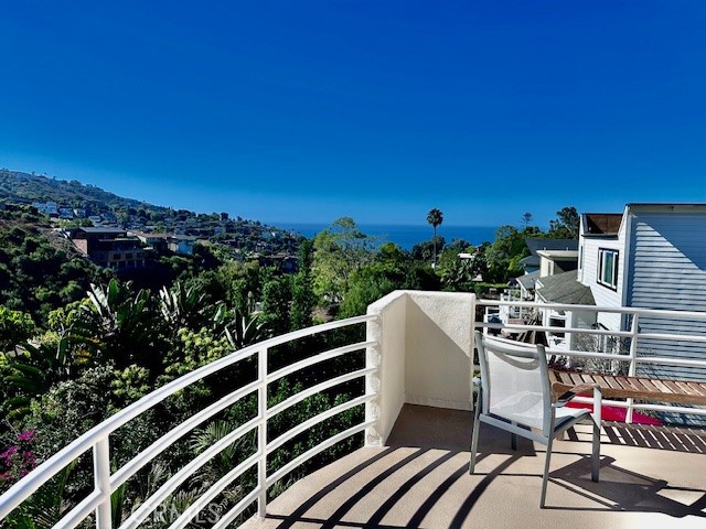 a view of a balcony with chairs