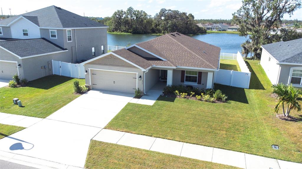 a aerial view of a house with a yard