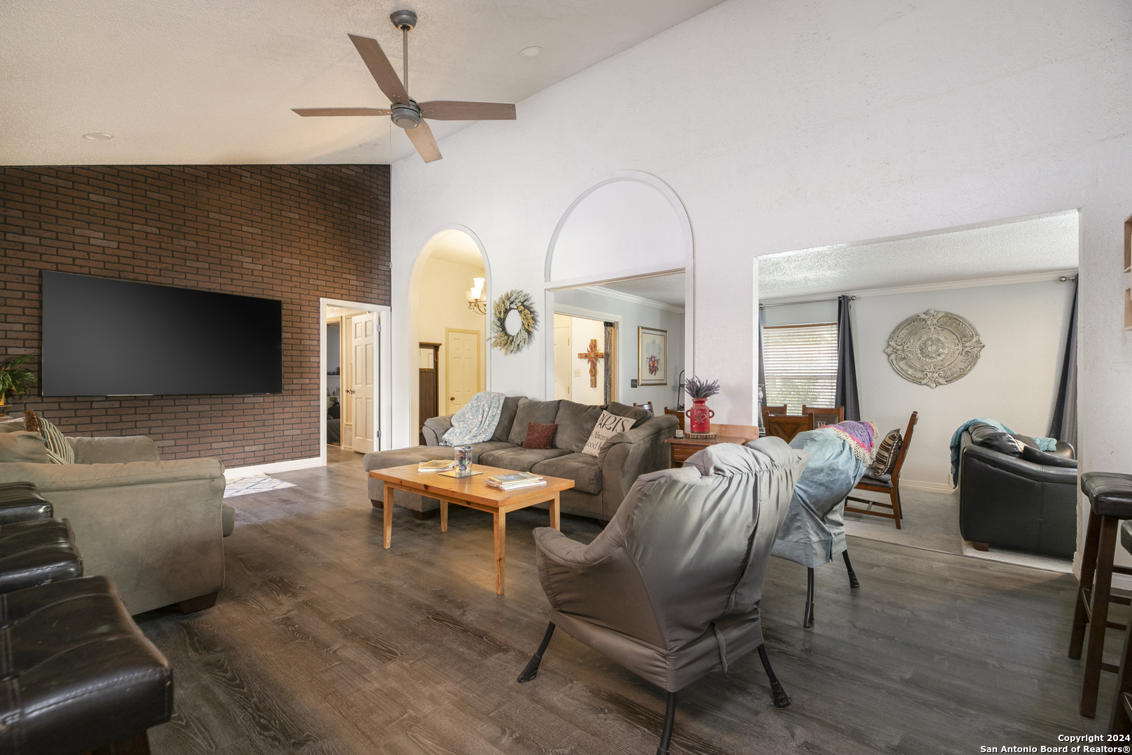 a living room with furniture and a flat screen tv