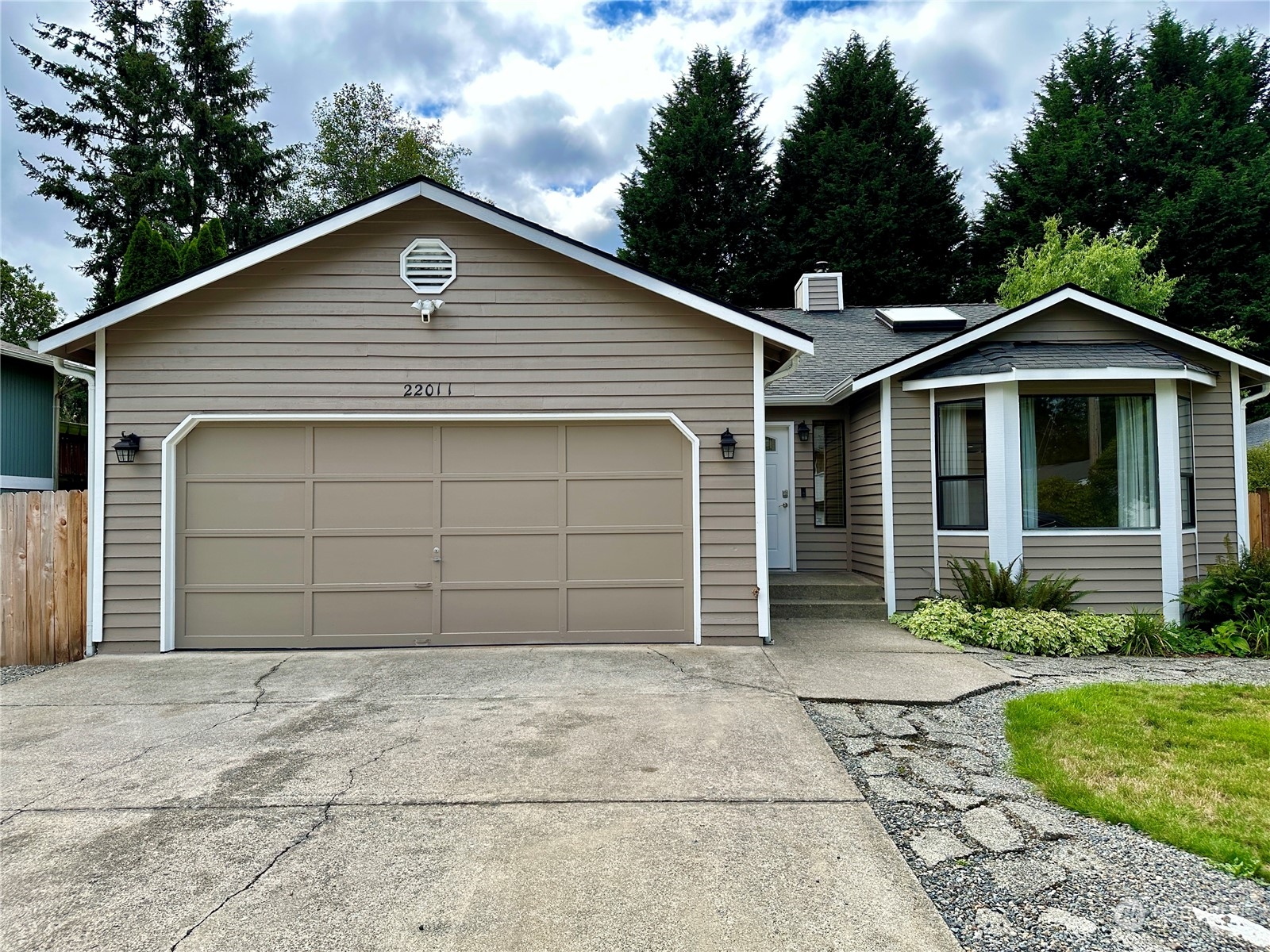 a front view of a house with a garage