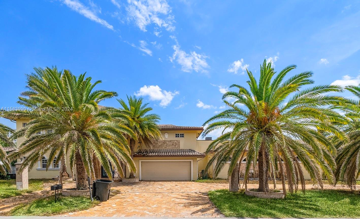 a view of a palm trees in front of a house