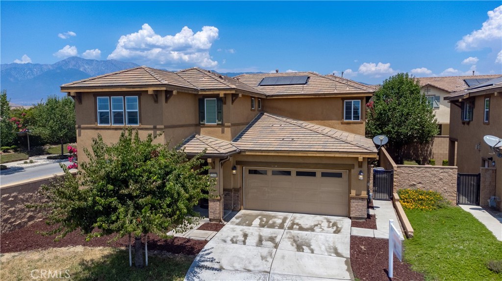 a aerial view of a house with yard and sitting area