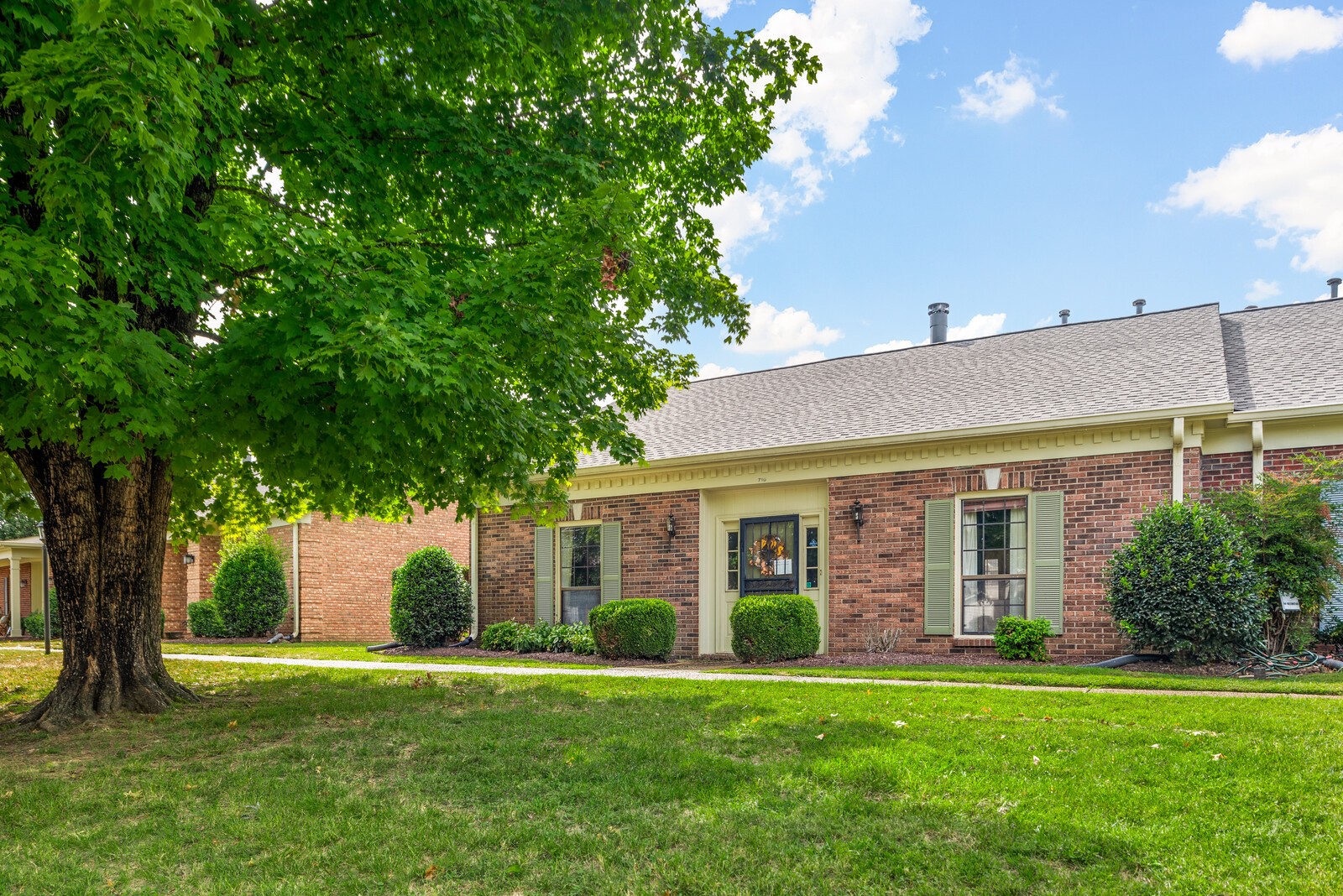 a front view of a house with a yard