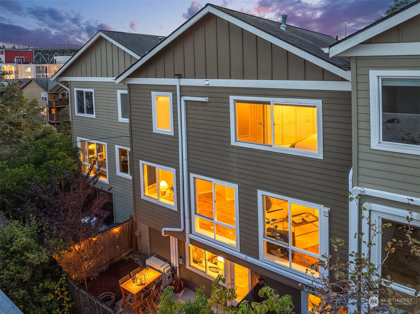 a view of an house with backyard space and balcony