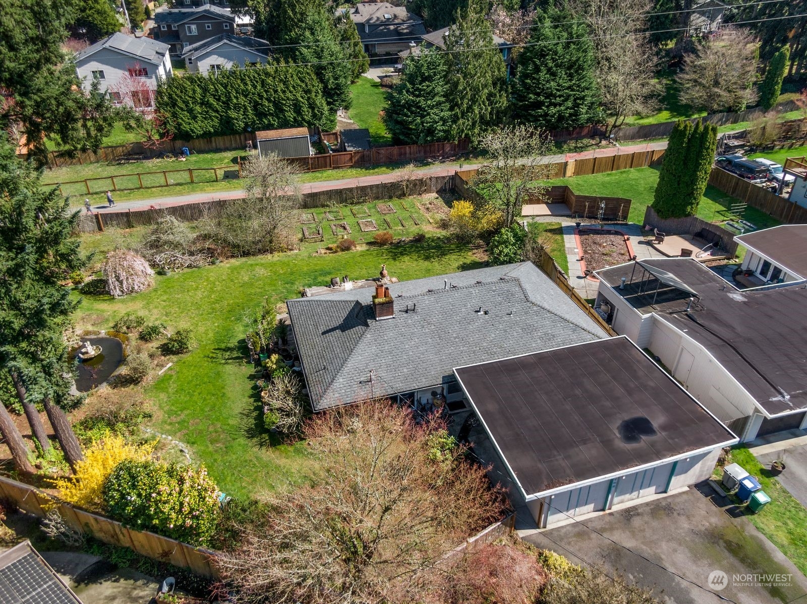 an aerial view of a house with a garden