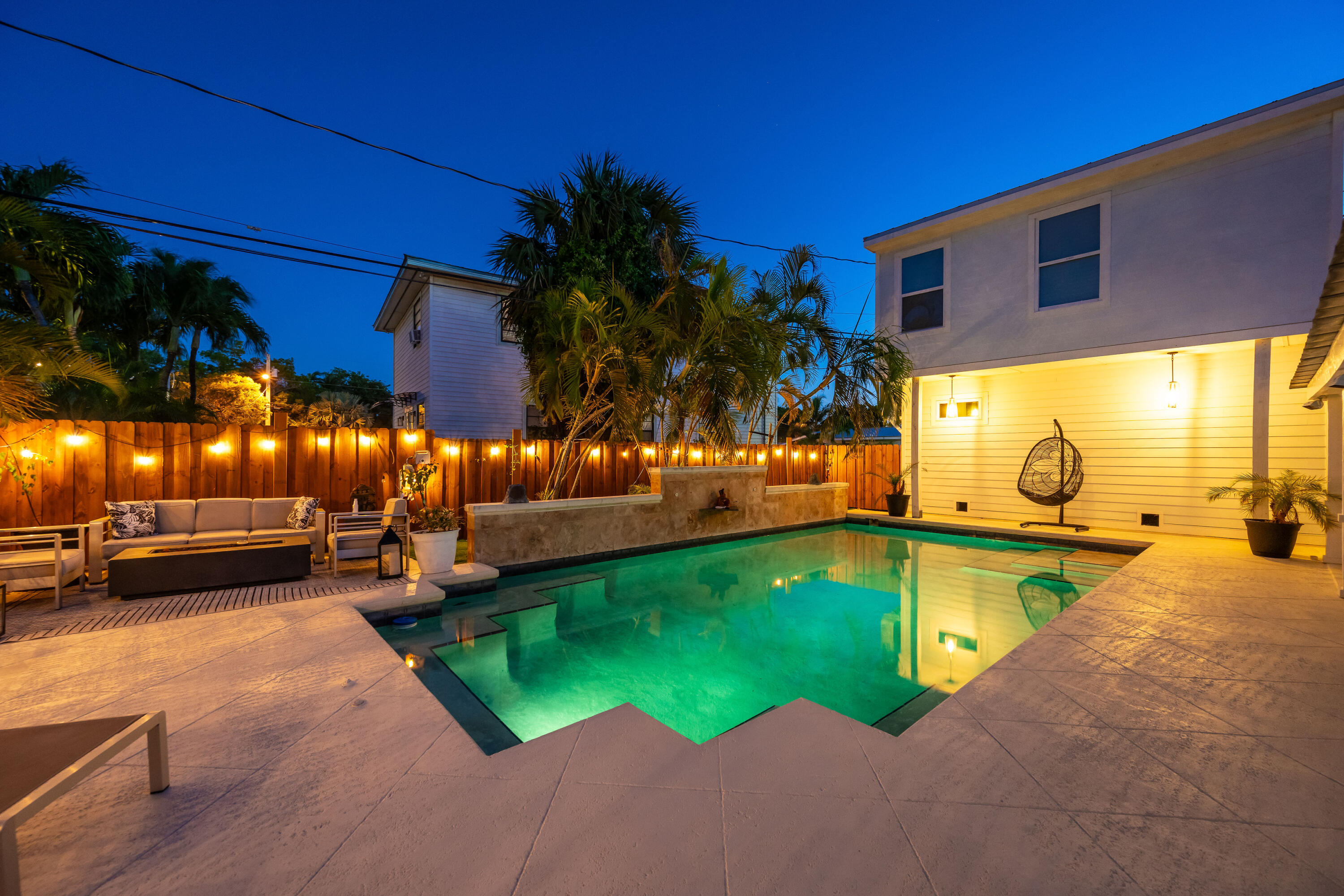 a view of a swimming pool with an outdoor space and seating area