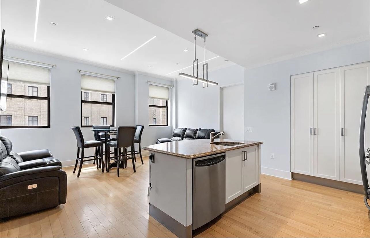 a kitchen with stainless steel appliances granite countertop a stove and a sink