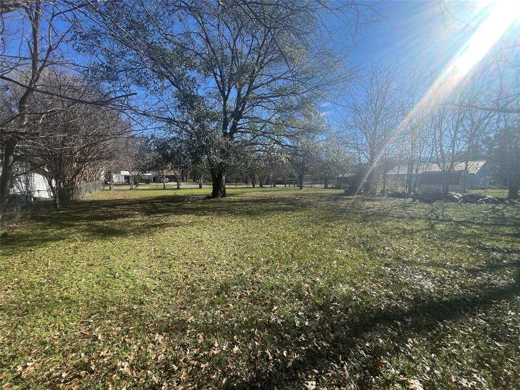 a yard with wooden fence