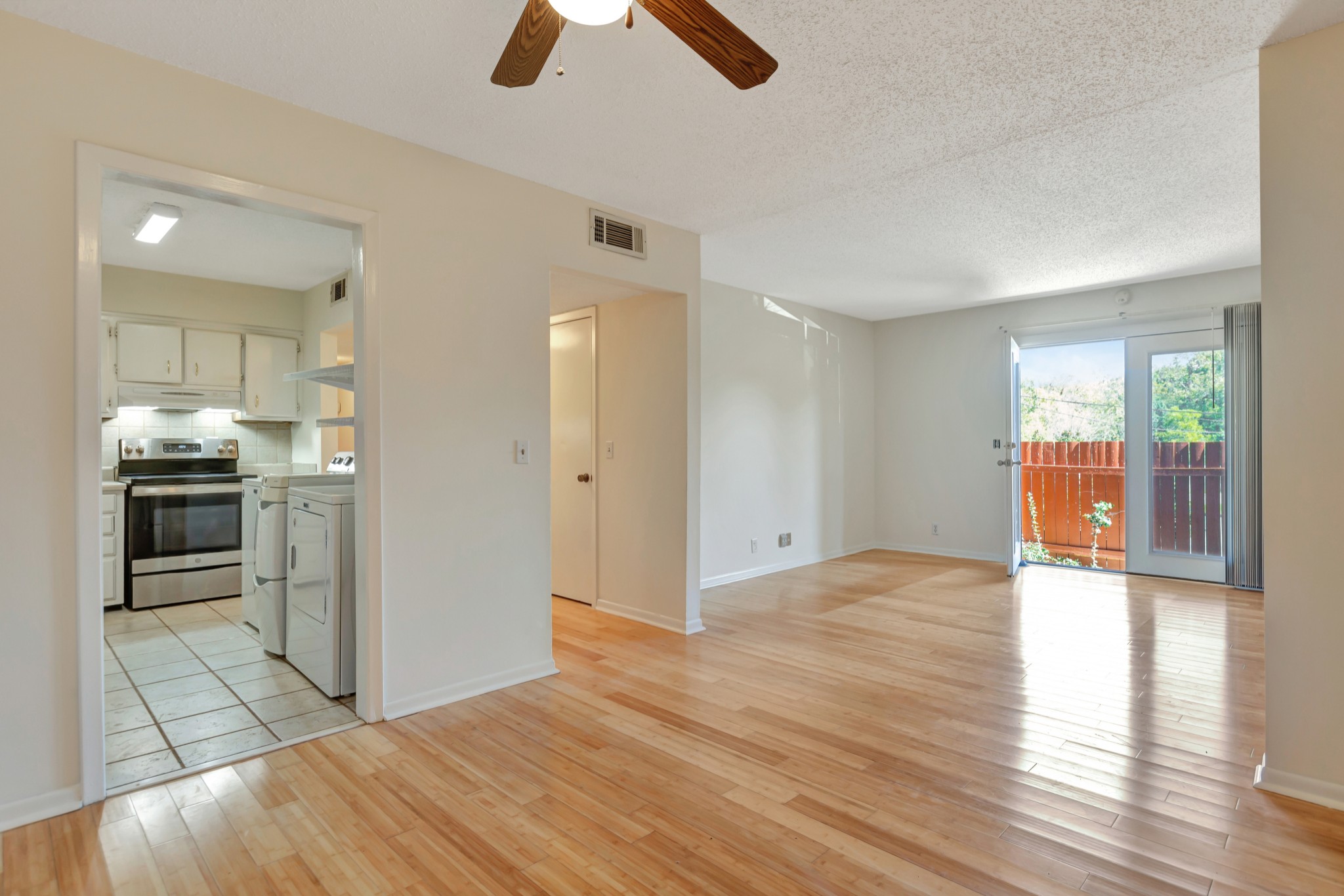 a view of a kitchen with furniture and a window