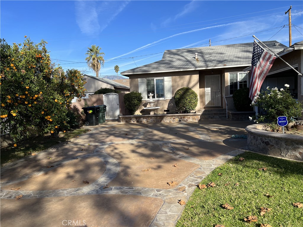 a view of a house with backyard porch and sitting area