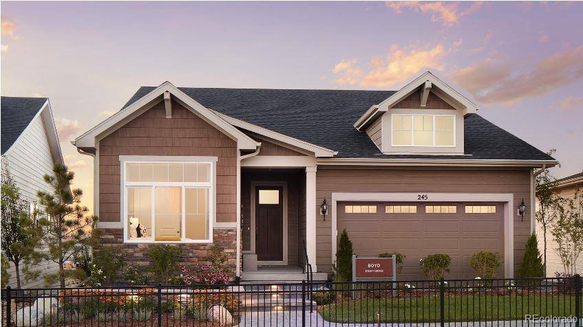 a front view of a house with garage