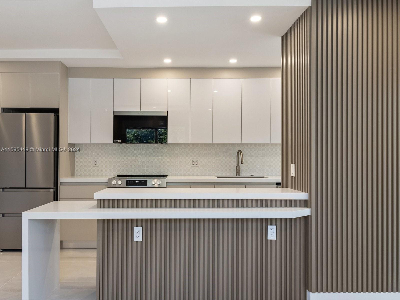 a kitchen with a stove and a microwave