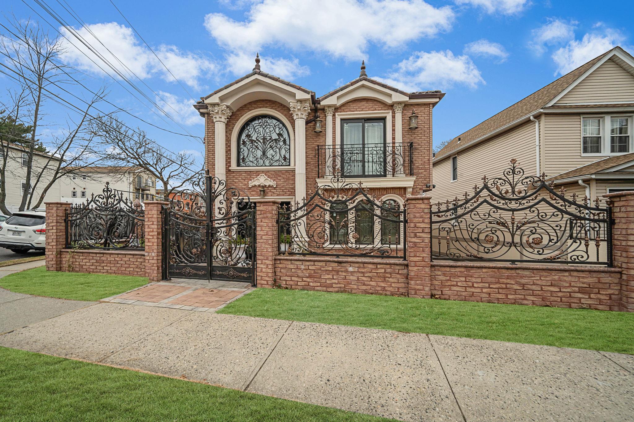 a front view of a house with garden