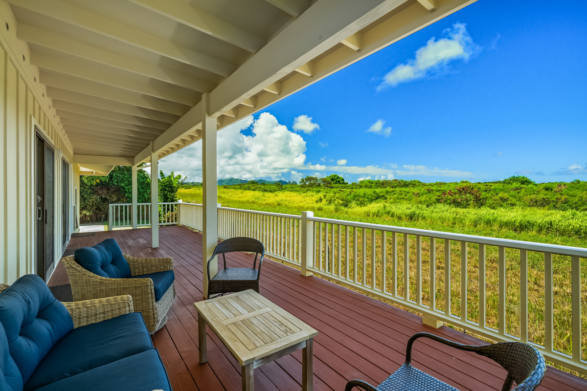 a view of a balcony with furniture