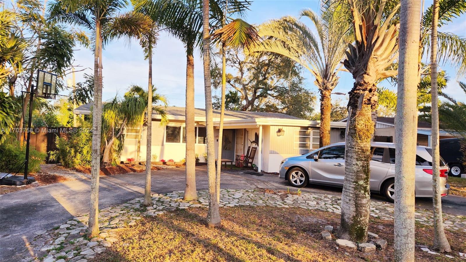 a front view of a residential apartment building with a yard