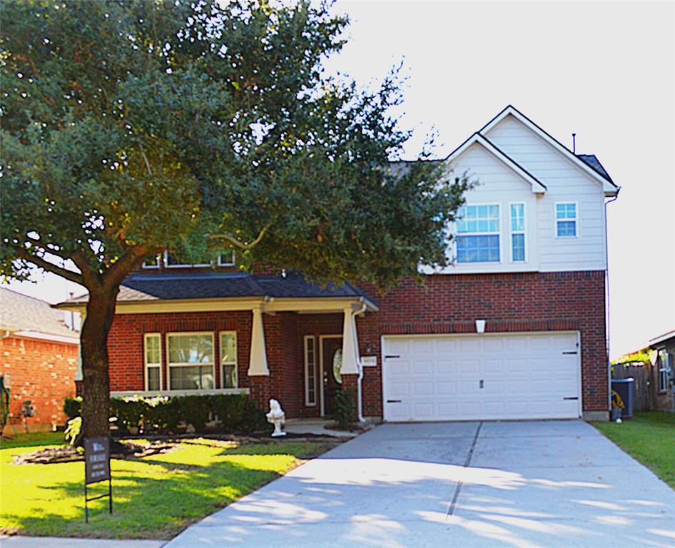 Charming two-story brick home with inviting curb appeal.