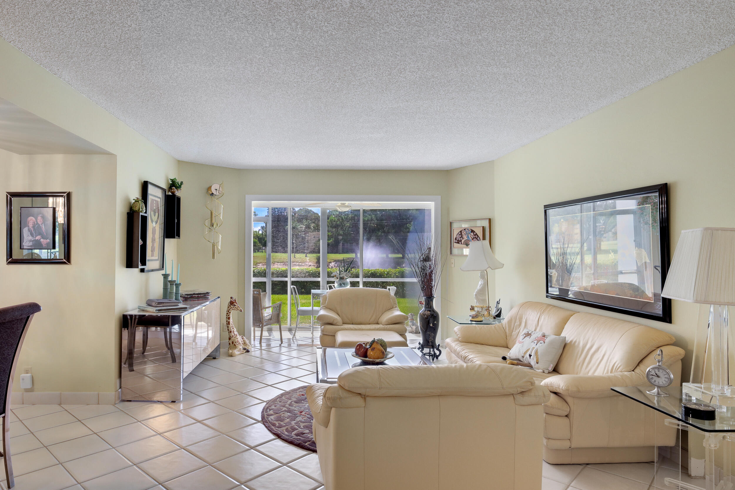 LIVING ONTO PATIO WITH FOUNTAIN VIEW