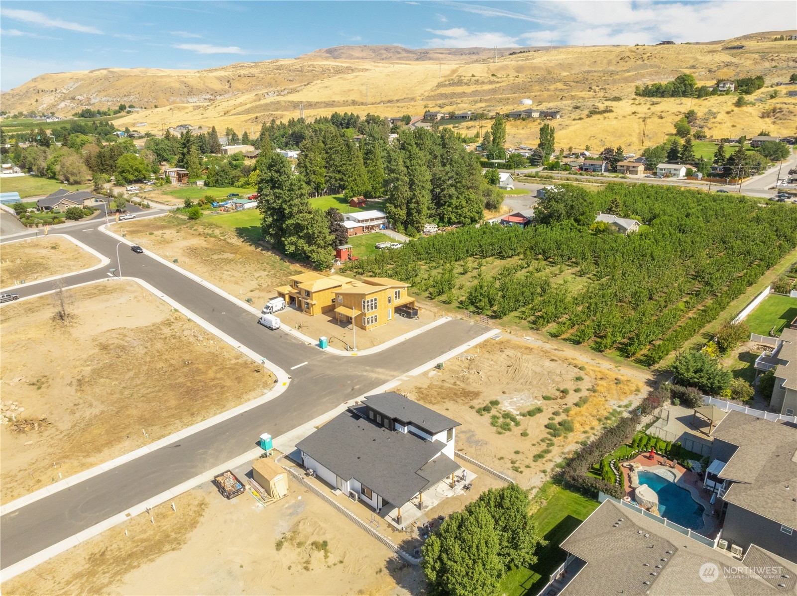 an aerial view of residential houses with outdoor space