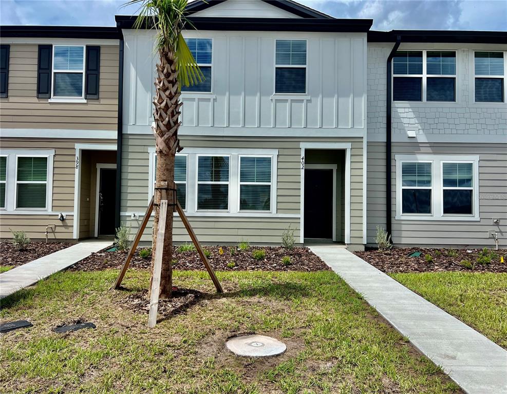 a front view of a house with a yard