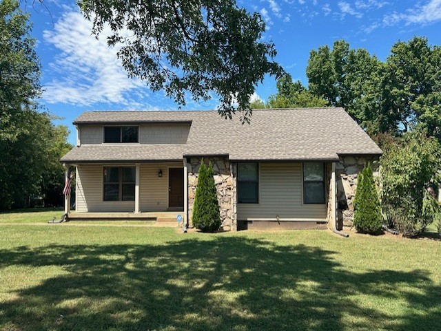 front view of a house with a yard