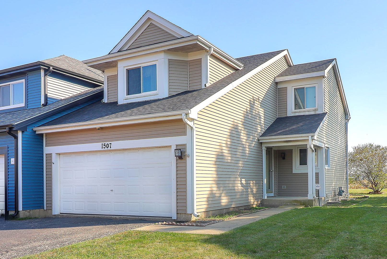 a front view of a house with a yard