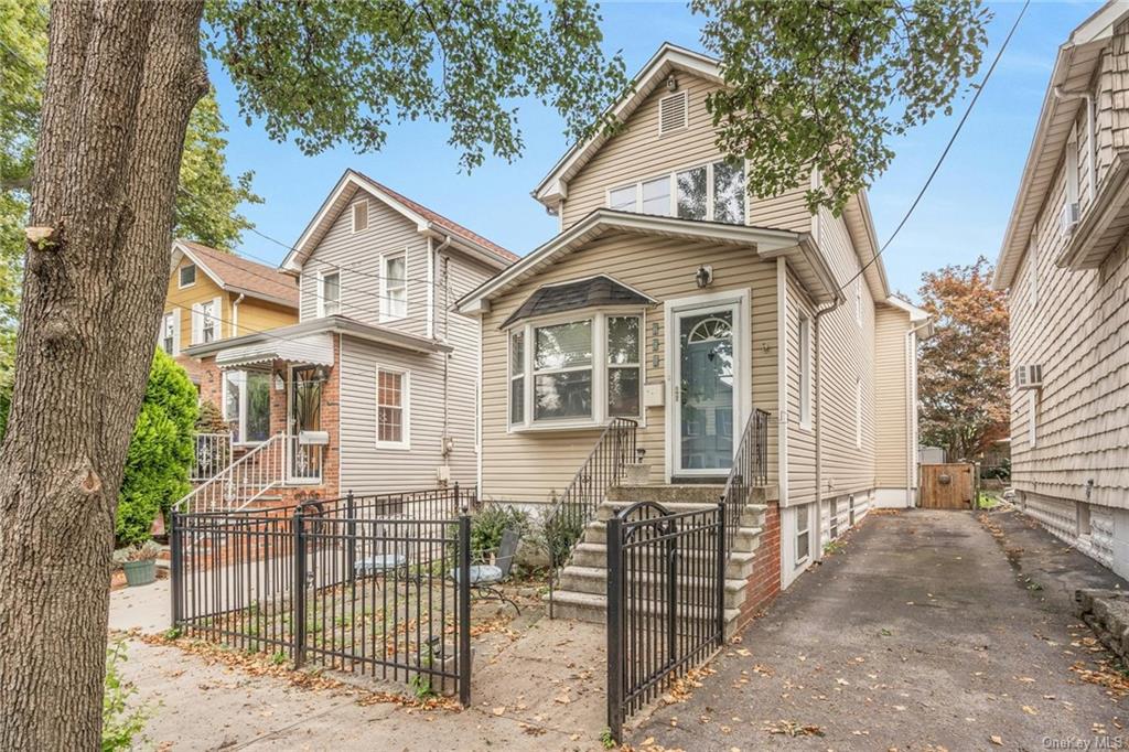 front view of a house with a small yard