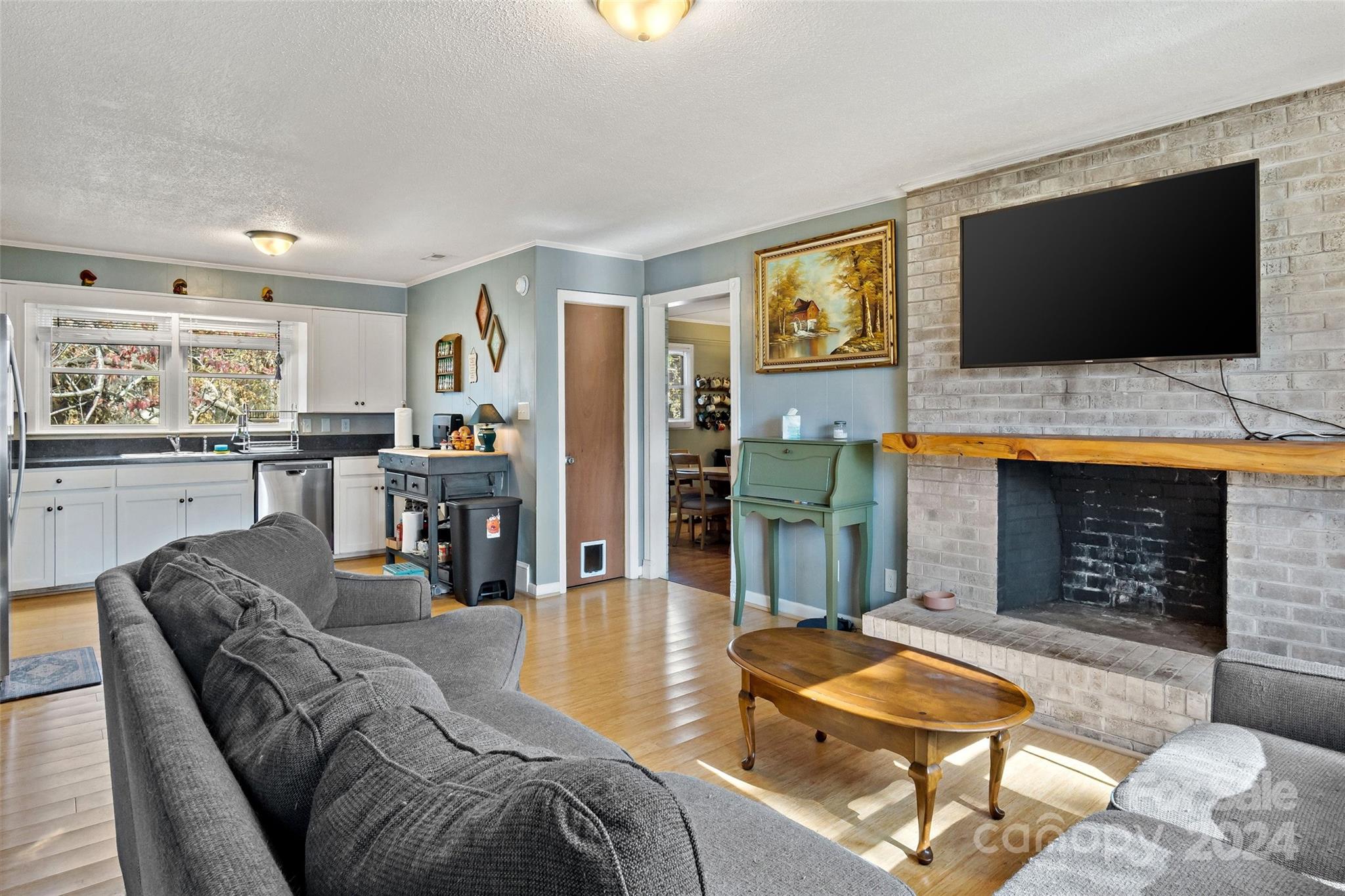 a living room with furniture and a flat screen tv