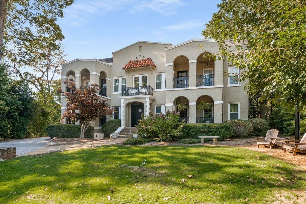 a front view of house with yard and green space