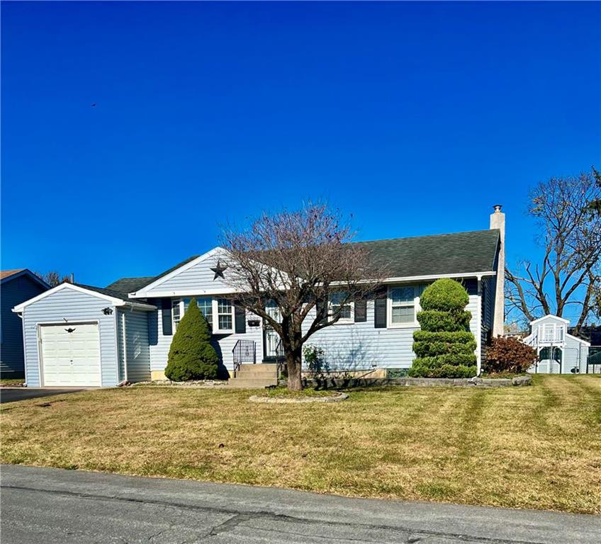 a front view of a house with garden