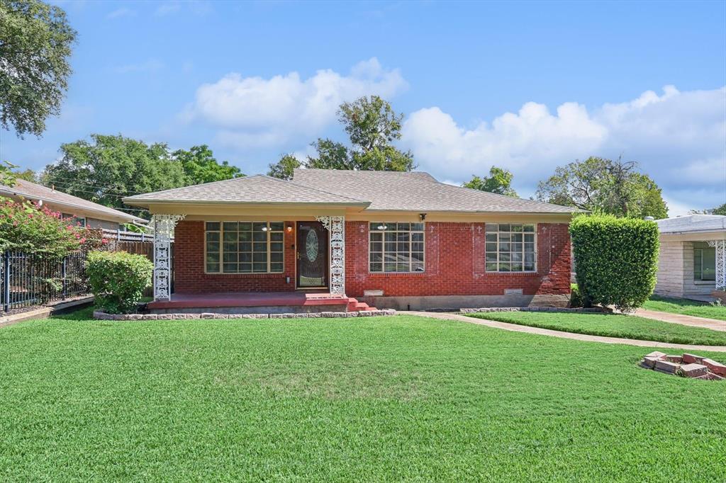 front view of a house with a yard